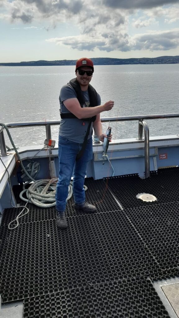 Sam fishing on the boat